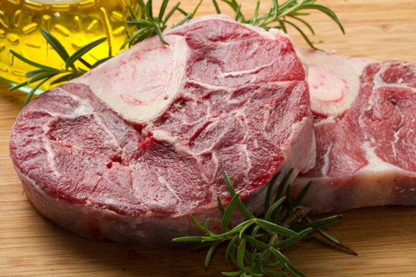 Slow-cooked veal osso buco served in a rich tomato and herb sauce