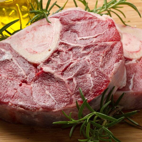 Slow-cooked veal osso buco served in a rich tomato and herb sauce